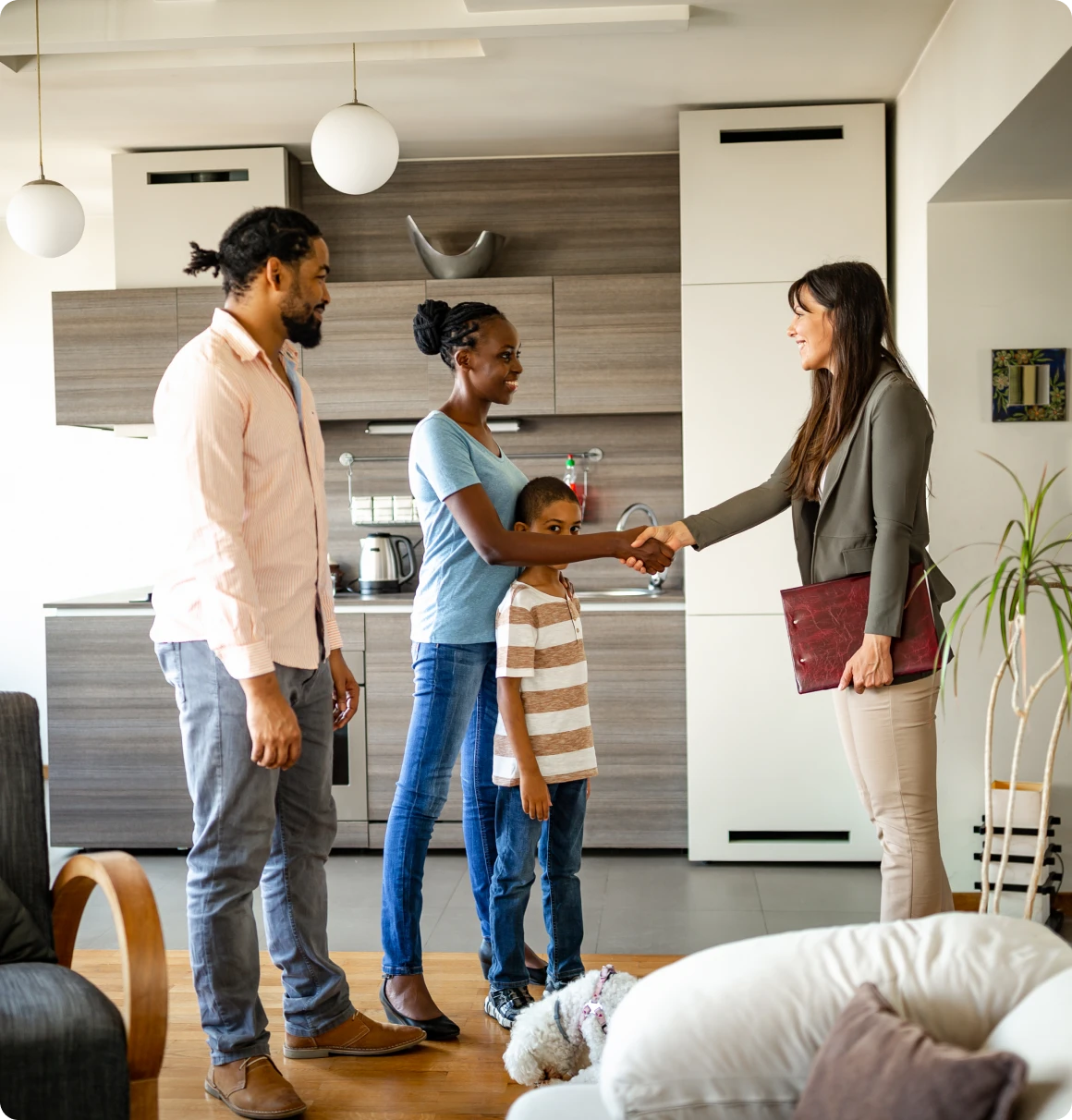 Family greeting a professional in kitchen