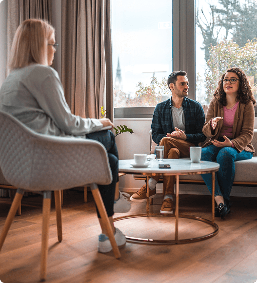 Couple in therapy session with therapist